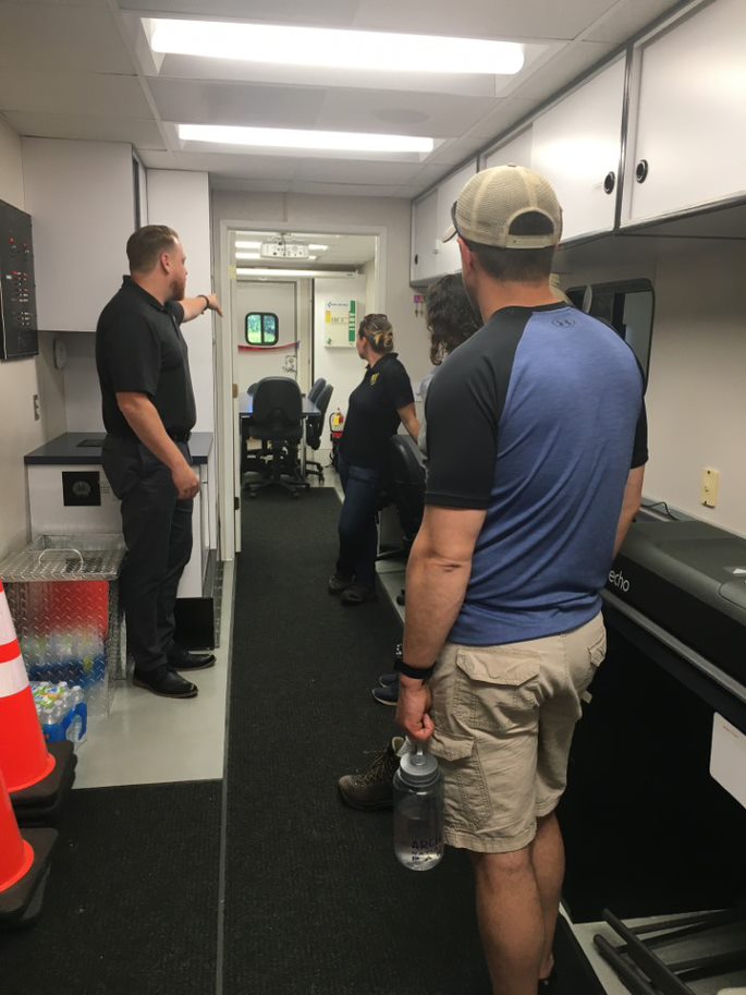 NOAA Science of Oil Spill Class tour Clean Rivers Command and Communications Trailer at the Cooperative Facility with General Manager Curtis Cannizzaro.