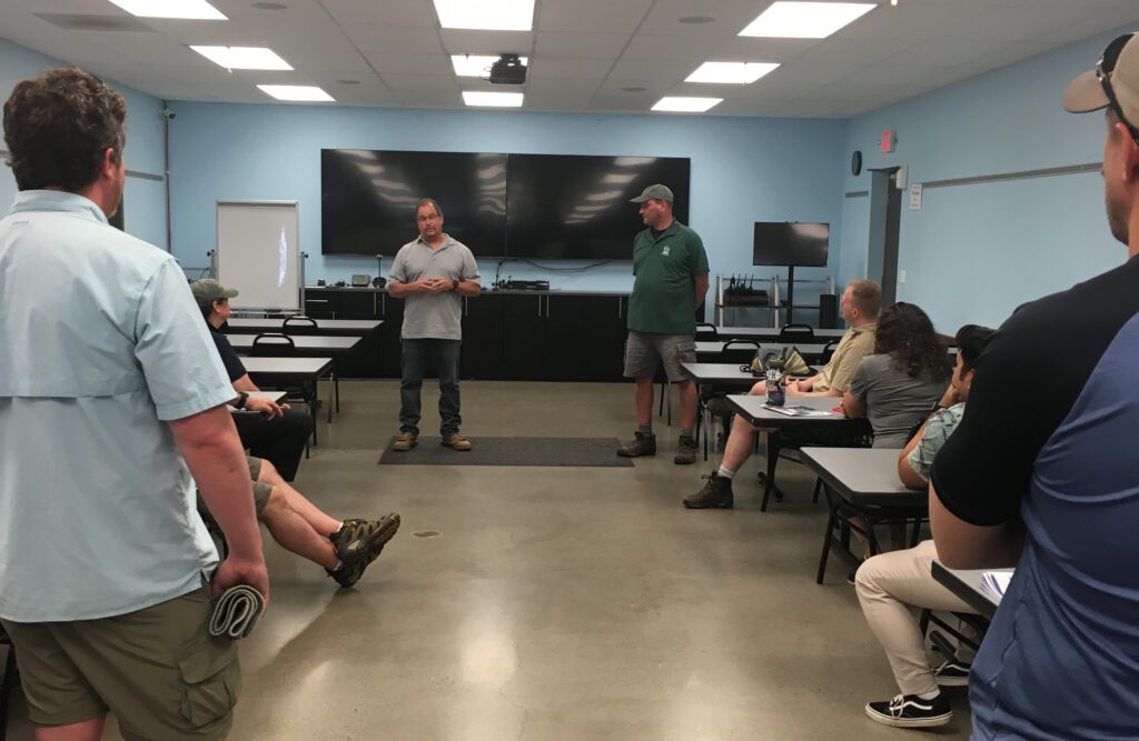 Operations Manager Carl Boelter gives a safety briefing to the NOAA Science of Oil Spill Class prior to tour at the Cooperative Operations training facility.