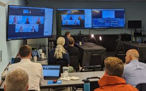 A large meeting room filled with people during ICS training