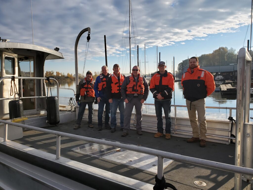 Clean Rivers Board Members and Staff pose on the newly repowered FRV Independence. From Left to Right: Carl Boelter, Doug Lenz, Todd Burke, Jeff Hibner, Ben Robinson, Curtis Cannizzaro